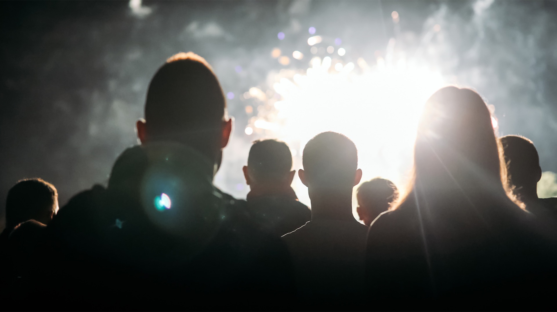 Outdoor movie screening at Millennium Park with city skyline