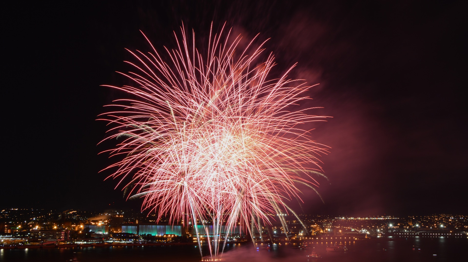 Navy Pier fireworks over Lake Michigan at night