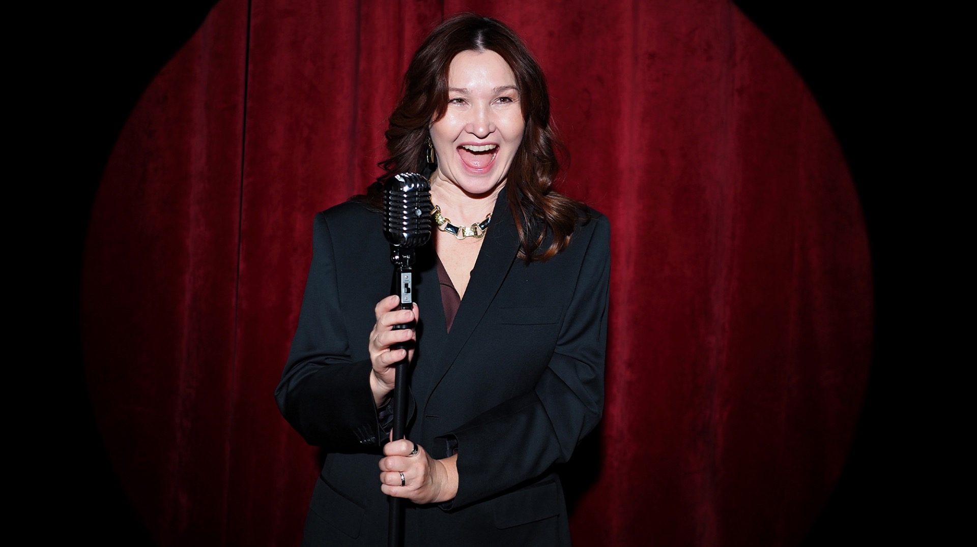 Second City comedy show with audience laughing at improv performance